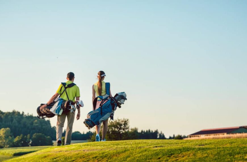 couple-walking-on-golf-course-1