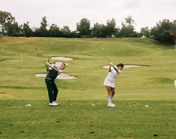 macklemore-and-golfers-on-the-driving-range