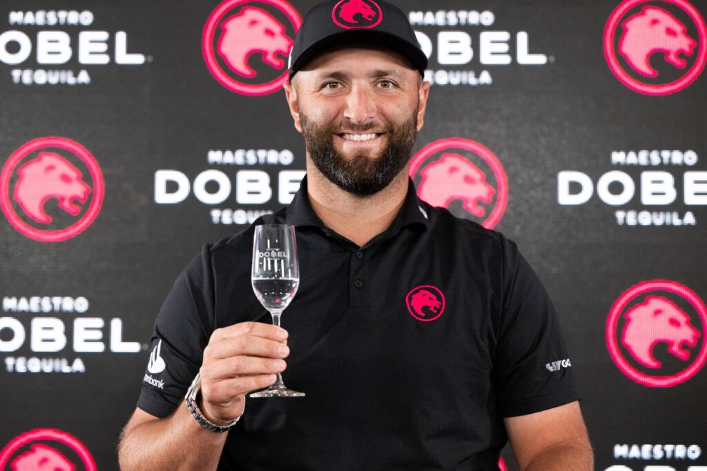 Jon Rahm raises a glass of Maestro Tequila