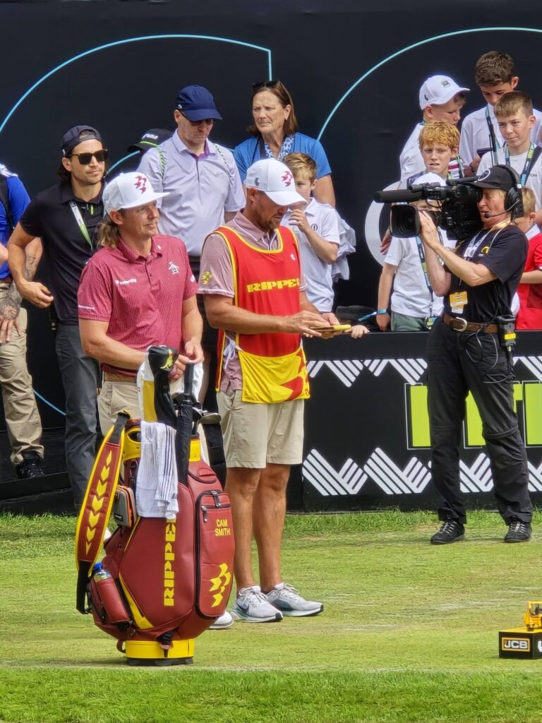 Cam Smith on 1st tee with caddie on the final round of LIV Golf UK