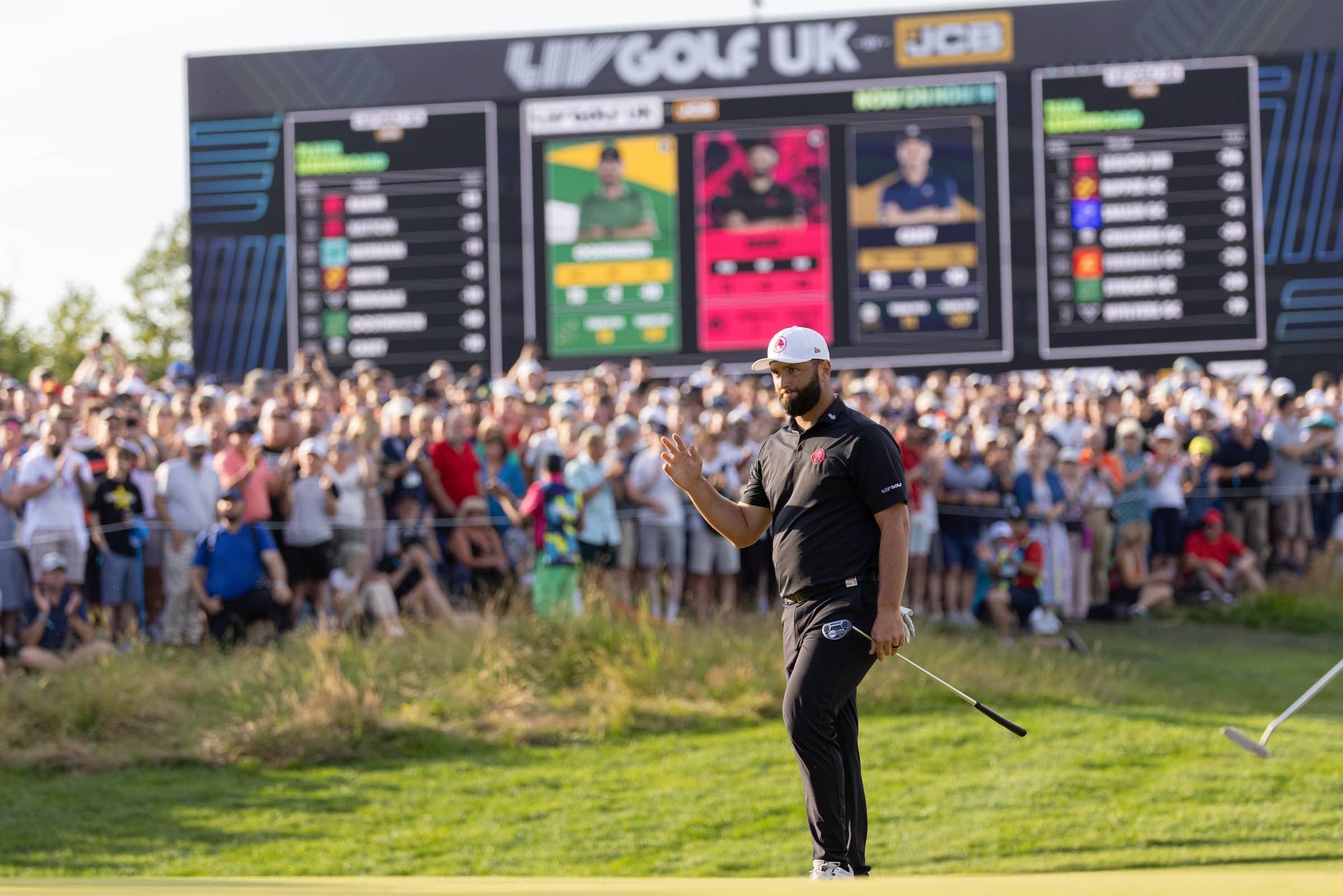 Captain Jon Rahm of Legion XIII waves to the crowd after putting out on the 18th green during the final round of LIV Golf United Kingdom