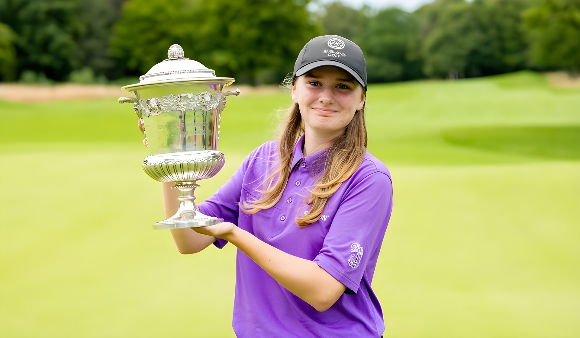 Lauren Crump holds the English Girls' Open Amateur Stroke Play Championship trophy