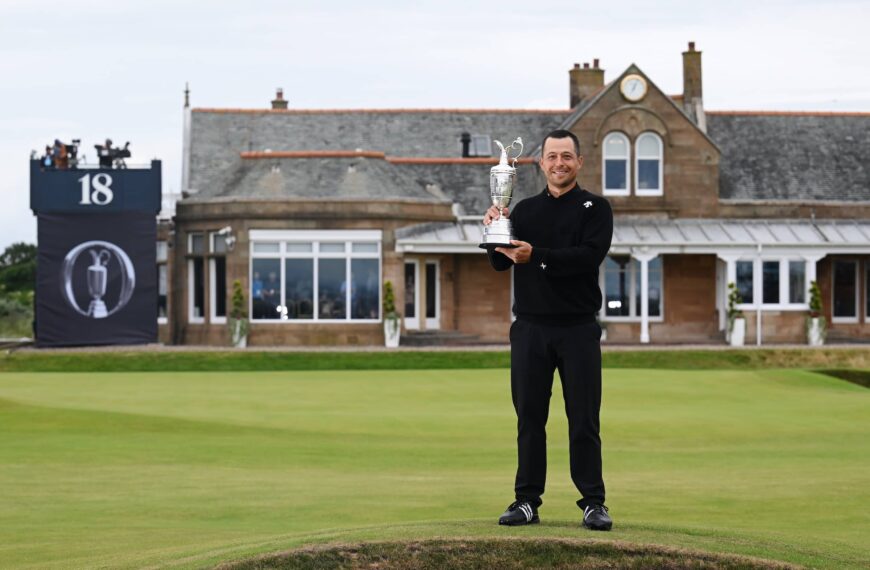 Xander Schauffele lifts the Claret Jug on the 18th green in celebration of victory on day four of The 152nd Open championship at Royal Troon