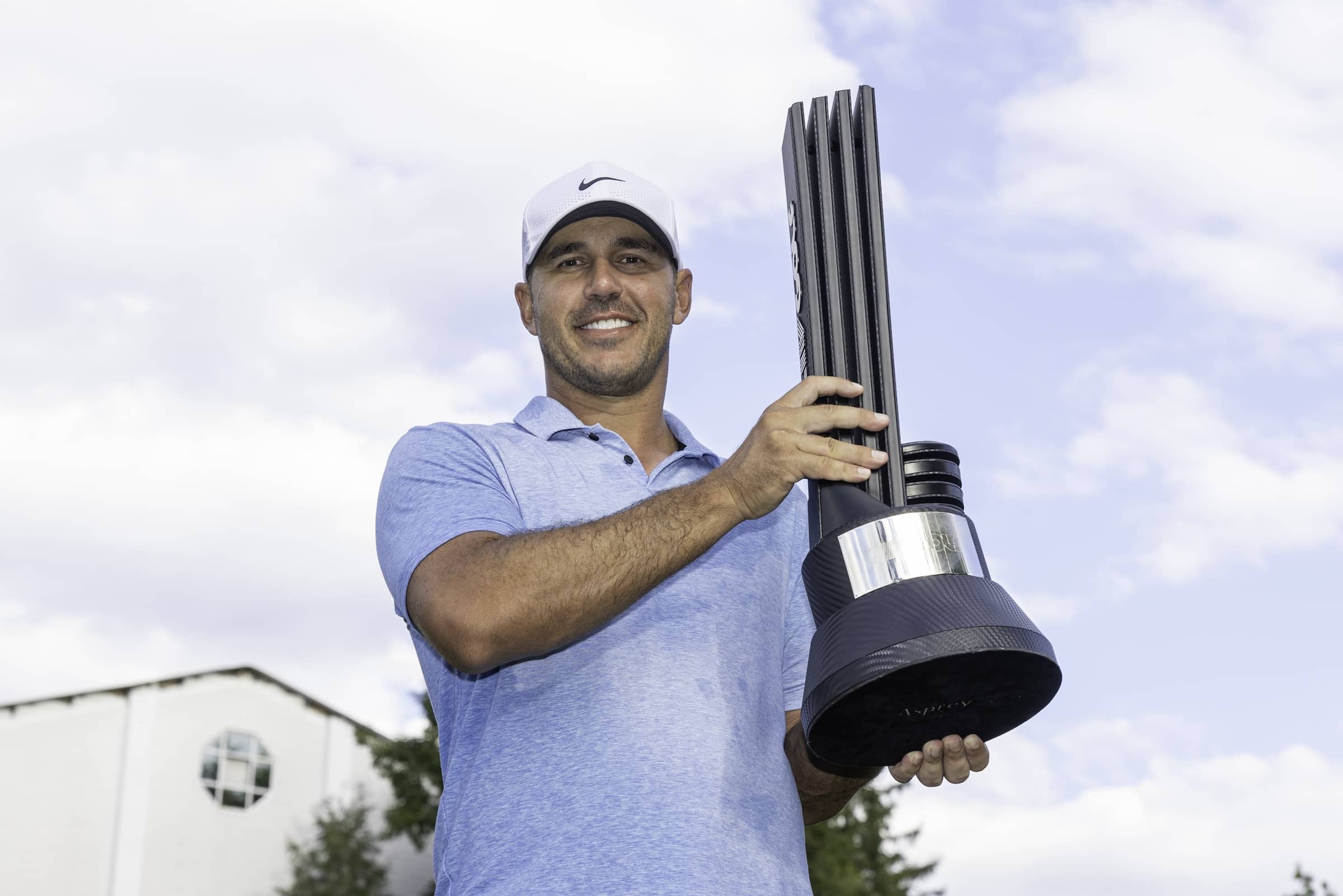 Individual Champion Captain Brooks Koepka of Smash GC poses with the trophy after the final round of LIV Golf Greenbrier