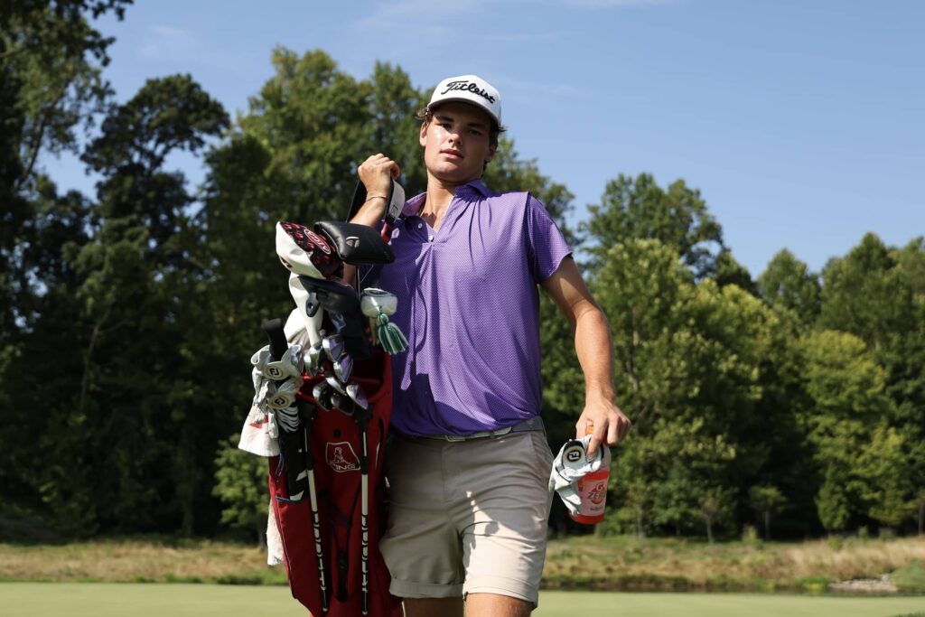 Jake Albert walks off the on the sixth hole putting green during the final round of the Junior PGA Championships at Congressional Country Club 