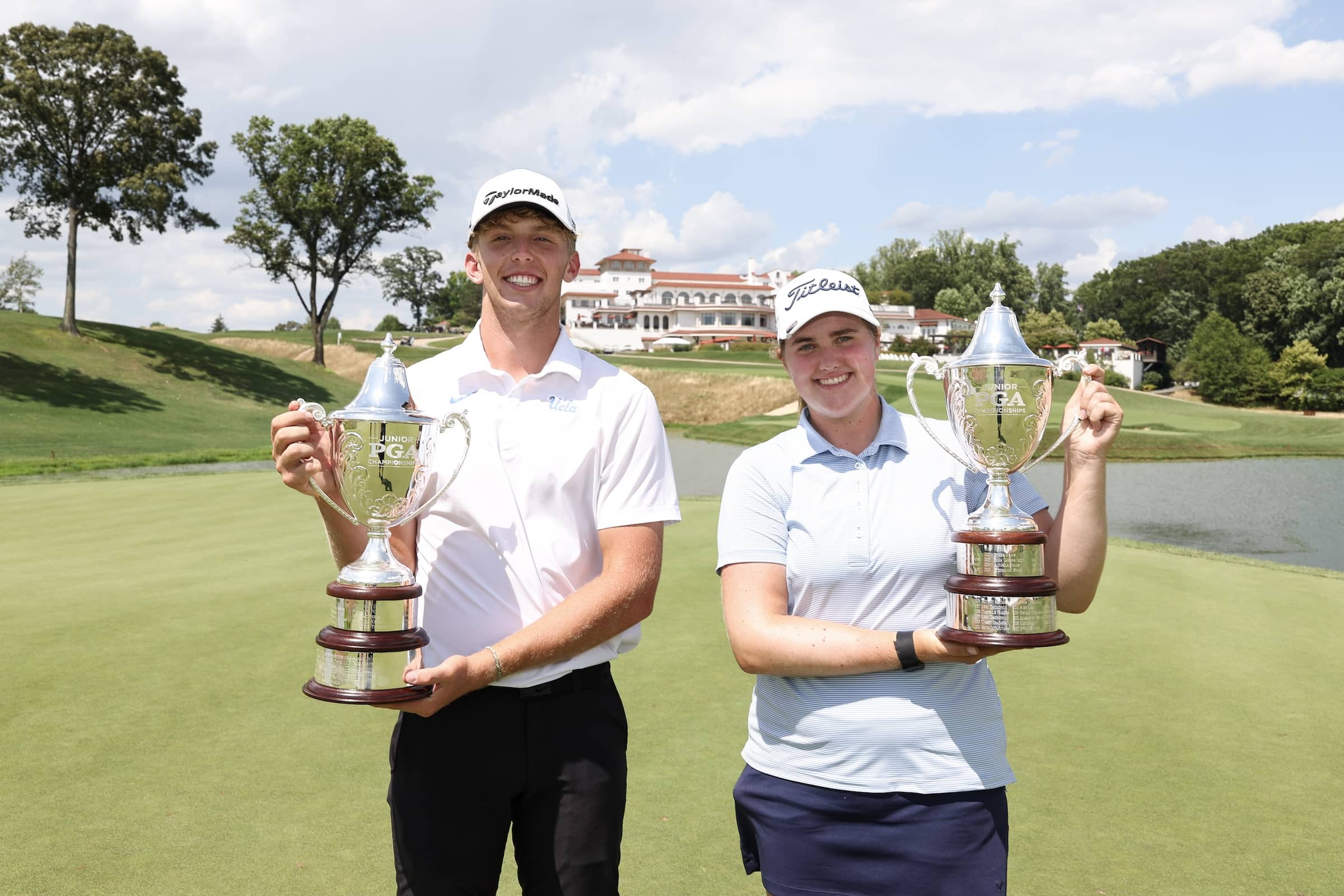 The Junior PGA Championships winners Baylor Larrabee and Avery McCrery pose with their trophies at Congressional Country Club.