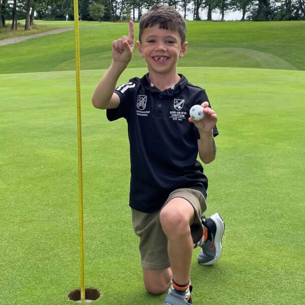 Young Golfer Walter Hall and his hole-in-one