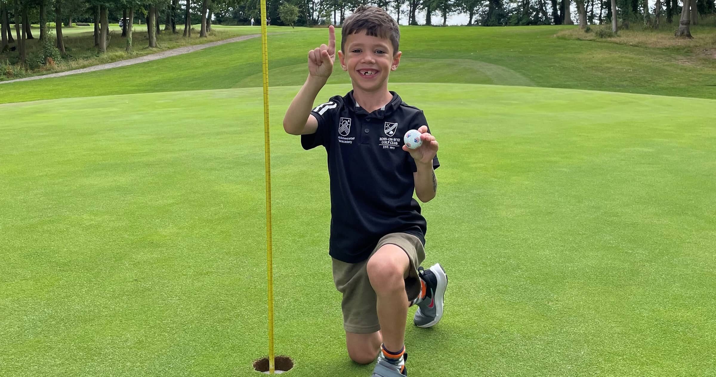 Young Golfer Walter Hall and his hole-in-one