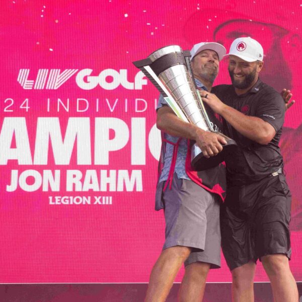 2024 Individual Champion Jon Rahm celebrates with caddie Adam Hayes at Bolingbrook Golf Club