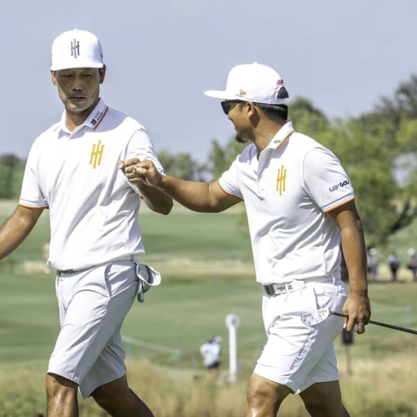 Captain Kevin Na of Iron Heads GC and Jinichiro Kozuma of Iron Heads GC fist pump on the 18th green