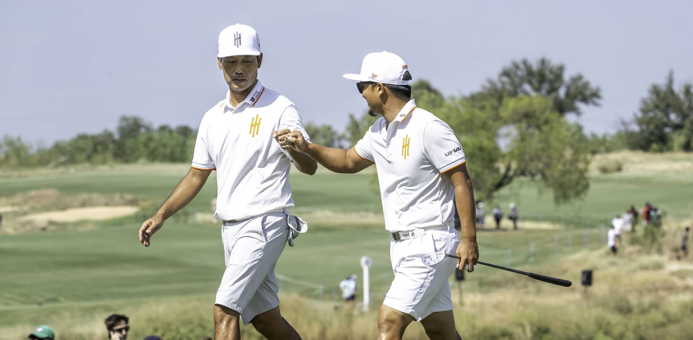 Captain Kevin Na of Iron Heads GC and Jinichiro Kozuma of Iron Heads GC fist pump on the 18th green