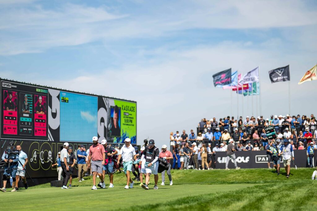 Legion XIII Captain Jon Rahm and Torque GC Captain Joaquín Niemann walk off the first tee during the first round of LIV Golf Chicago