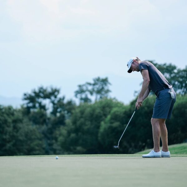 Chris Wood hits a putt during a pre-tournament practice round at the Black Mountain Championship in Hua Hin, Thailand