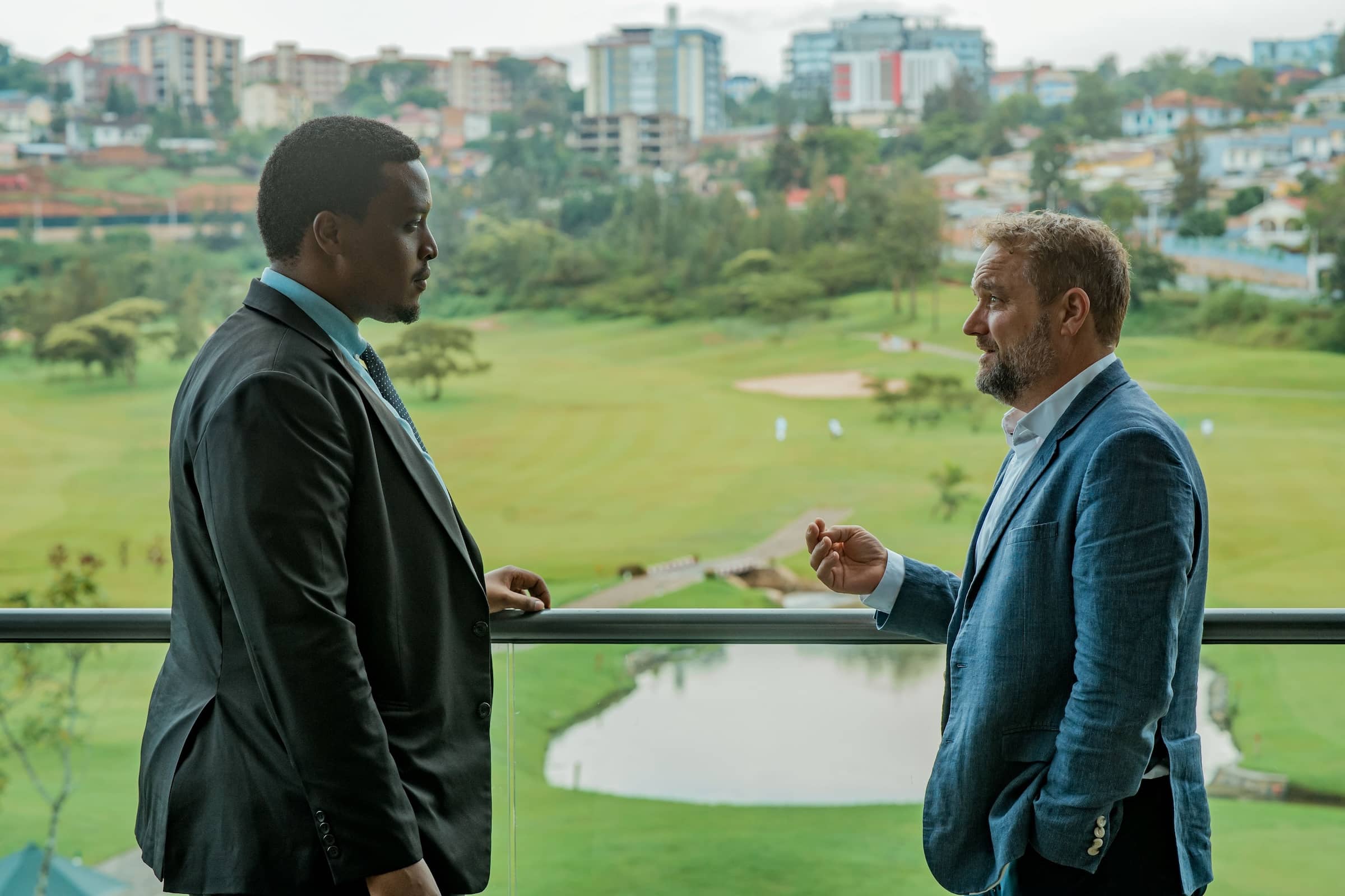 Josue Dushimimana (pictured left), CEO of Rwanda Ultimate Golf Course, and Ed Edwards, 54 CEO, on the clubhouse balcony at Kigali Golf Resort and Villas.