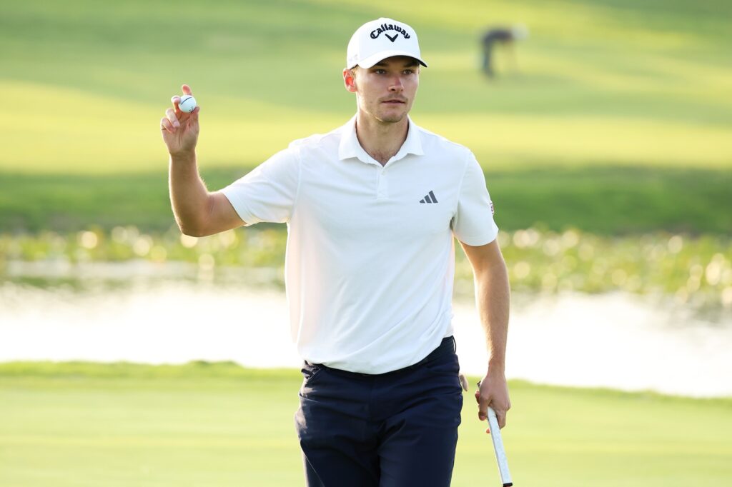 Nicolai Hojgaard of Denmark acknowledges the crowd after birdie on the 17th green on day one of the Genesis Championship 2024 at Jack Nicklaus GC Korea .