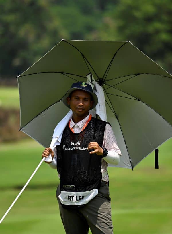 Eddy Sujono, caddie for BNI Indonesian Masters champion Richard T. Lee, during round four at the Royale Jakarta Golf Club