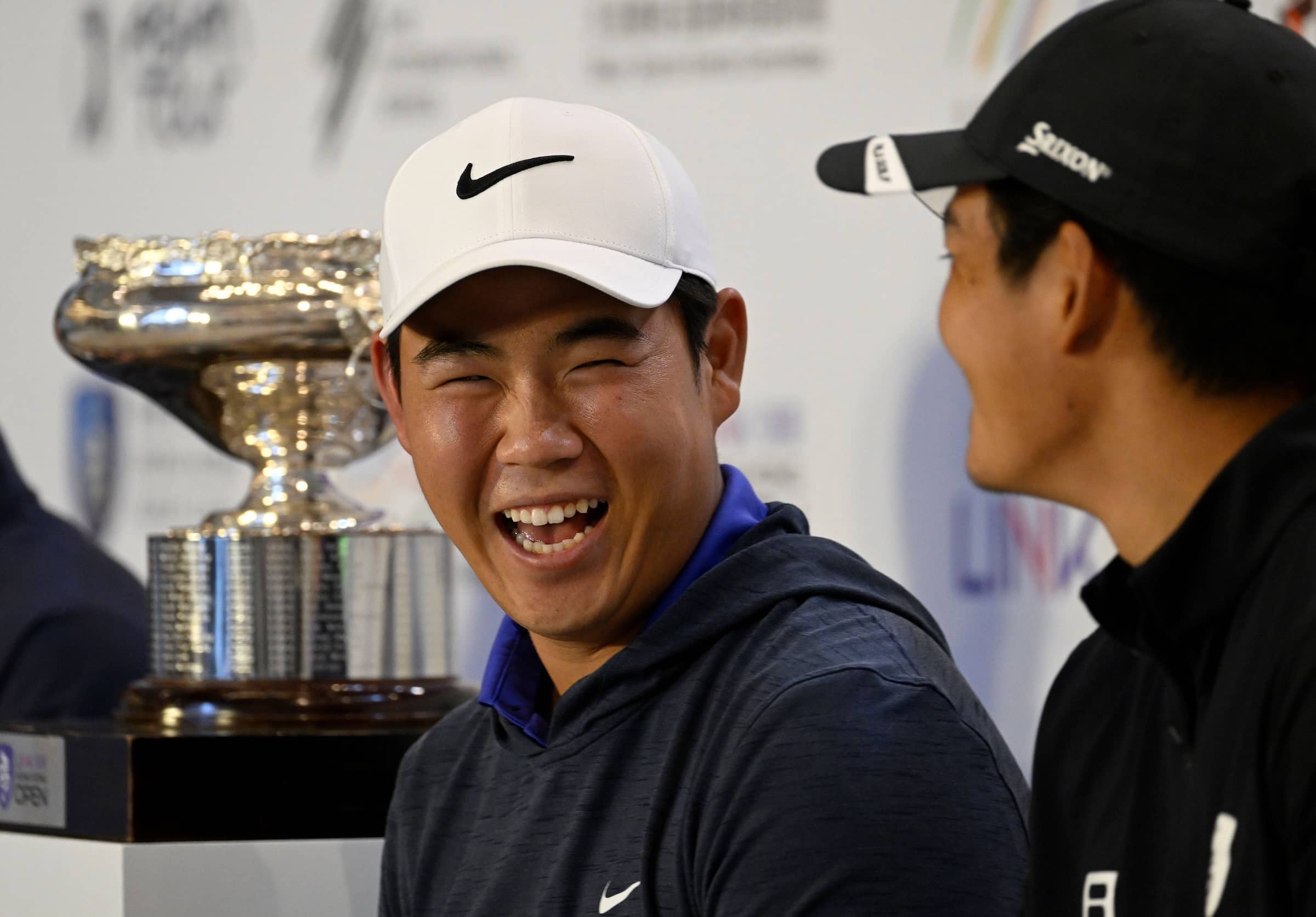 Tom Kim shares a laugh with Taichi Kho during the pre-tournament press conference ahead of the Link Hong Kong Open, the eighth event on The International Series