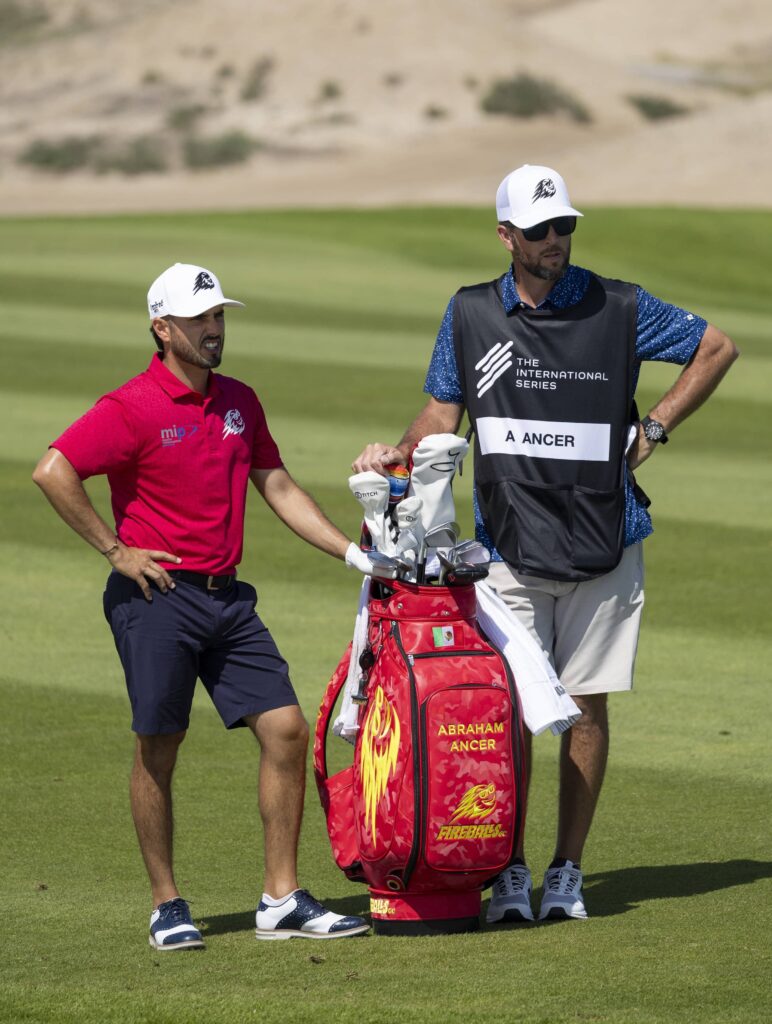 Abraham Ancer pictured with his caddie at Riyadh Golf Club