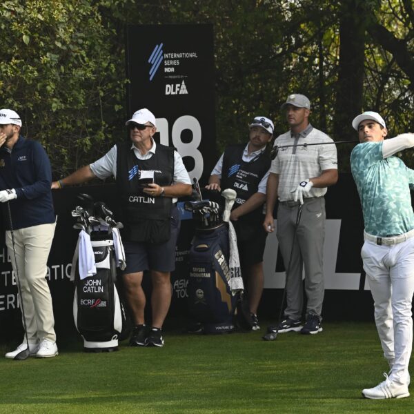 Joaquin Niemann pictured alongside Bryson DeChambeau and John Catlin on the 18th hole at DLF Golf and Country Club