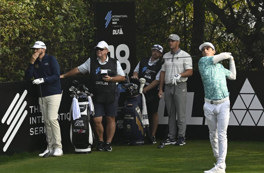 Joaquin Niemann pictured alongside Bryson DeChambeau and John Catlin on the 18th hole at DLF Golf and Country Club