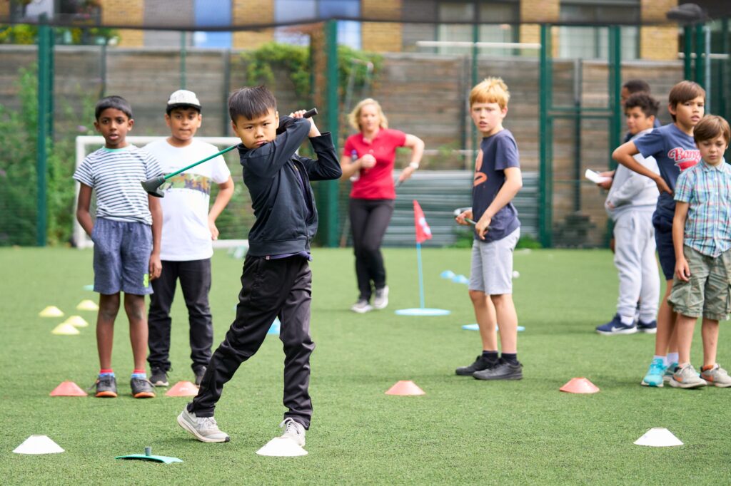 Youngsters practicing golf