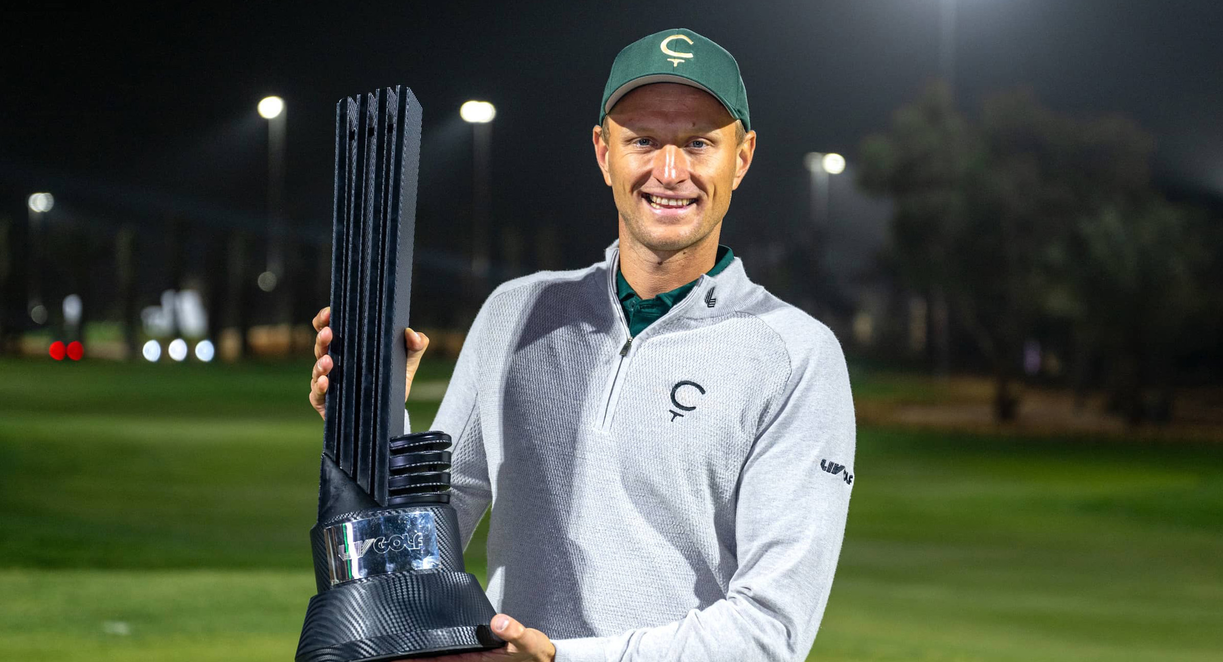 First place individual champion Adrian Meronk of Cleeks GC poses with the trophy on the 18th green after the final round of LIV Golf Riyadh at Riyadh Golf Club