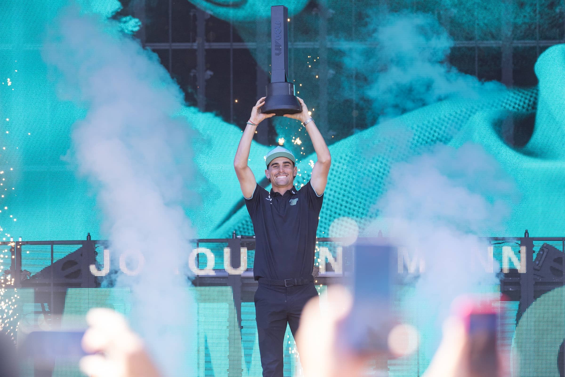 First place individual champion Captain Joaquín Niemann of Torque GC holds up the Individual Champion Trophy at the Trophy Ceremony after the final round of LIV Golf Adelaide