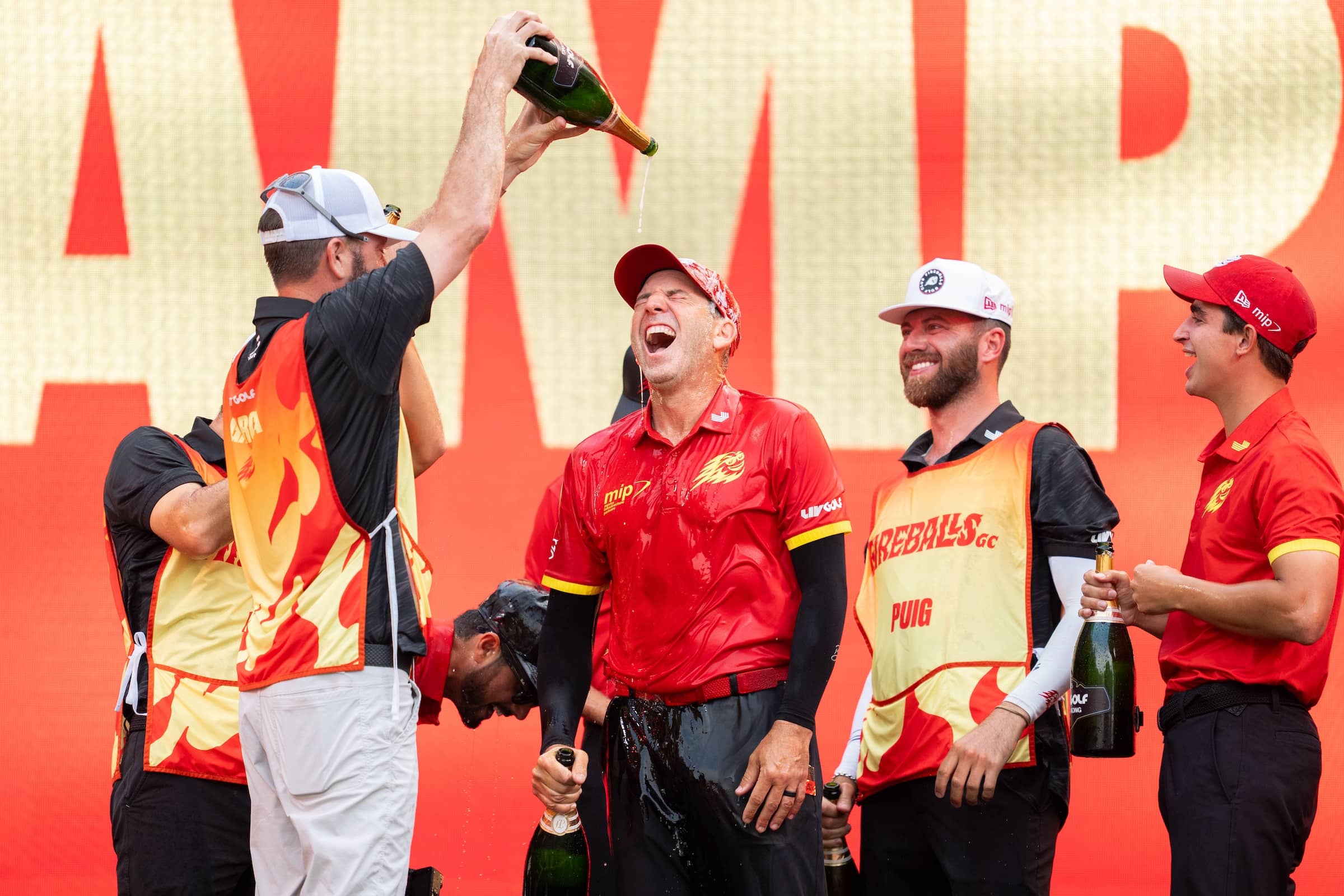 First place team champions, Captain Sergio Garcia of Fireballs GC, David Puig of Fireballs GC, Luis Masaveu of Fireballs GC, caddie, Benji Thompson, caddie, Alberto Sanchez, celebrate at the trophy ceremony after the final round of LIV Golf Hong Kong at Hong Kong Golf Club