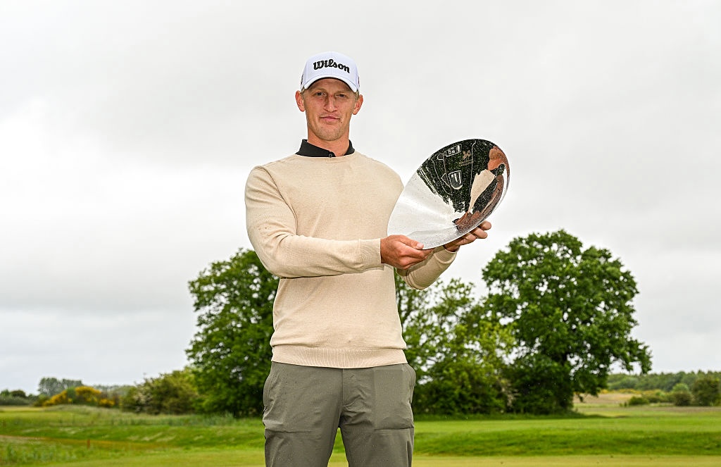 Jonathan Goth-Rasmussen of Denmark poses for a photo with the trophy following his victory of the Danish Golf Challenge 2025 at Bogense Golfklub