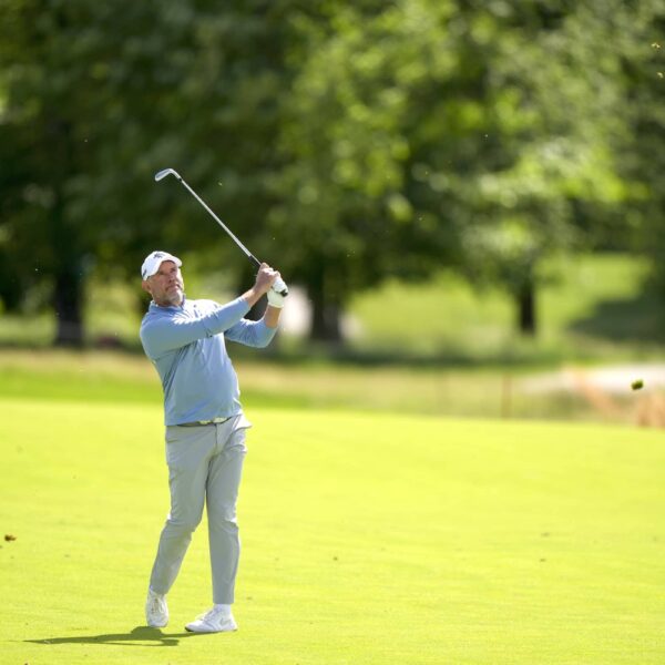 Lee Westwood hits his second shot on the 18th hole during the third round of the Senior PGA Championship at Congressional Country Club