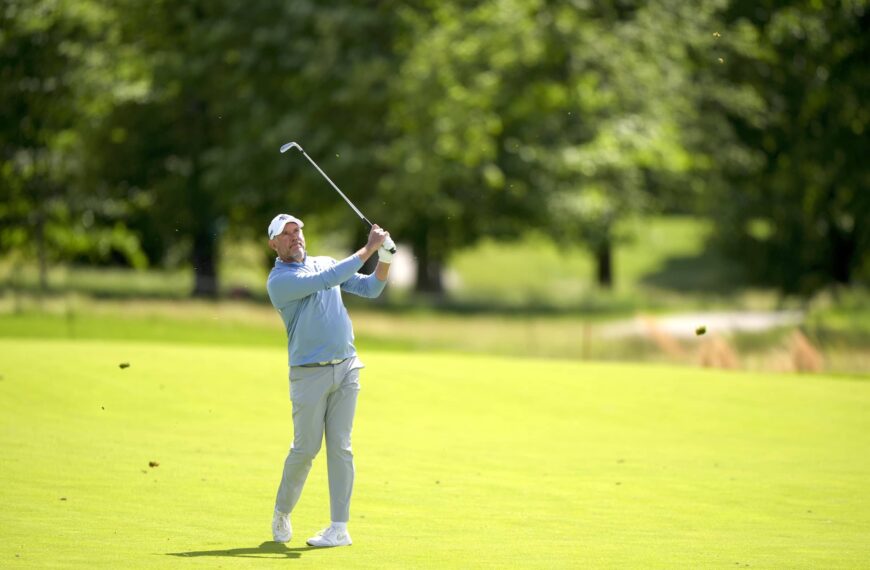 Lee Westwood hits his second shot on the 18th hole during the third round of the Senior PGA Championship at Congressional Country Club