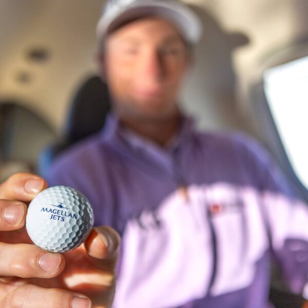 Magellan Jets Passenger holding Golf Ball
