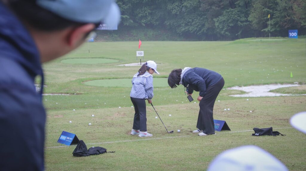 A child from the First Tee Korea initiative on the driving range at New Korea Country Club