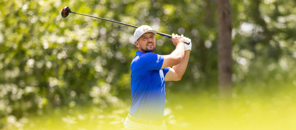 Captain Bryson DeChambeau of Crushers GC hits his shot from the fifth tee during the first round of LIV Golf Virginia